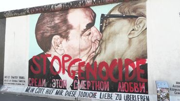 Activists paint 'Stop genocide' over Berlin's famous Bruderkuss mural | AFP