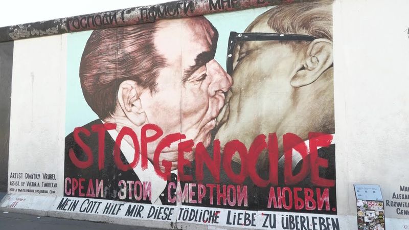 Activists paint 'Stop genocide' over Berlin's famous Bruderkuss mural | AFP