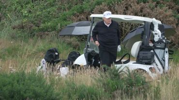 US President Donald Trump plays golf at his Turnberry resort in Scotland | AFP