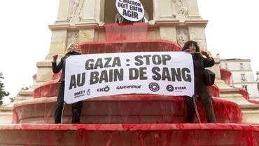 Activists dye Paris fountain red to say 'stop the bloodbath' in Gaza | AFP