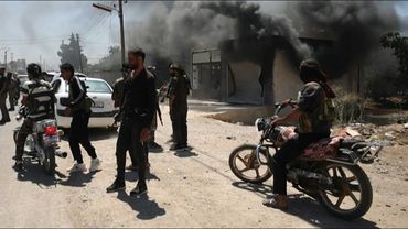 Smoke rises as Syria tribes clash with Druze fighters near Sweida | AFP