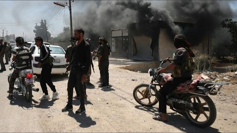 Smoke rises as Syria tribes clash with Druze fighters near Sweida | AFP