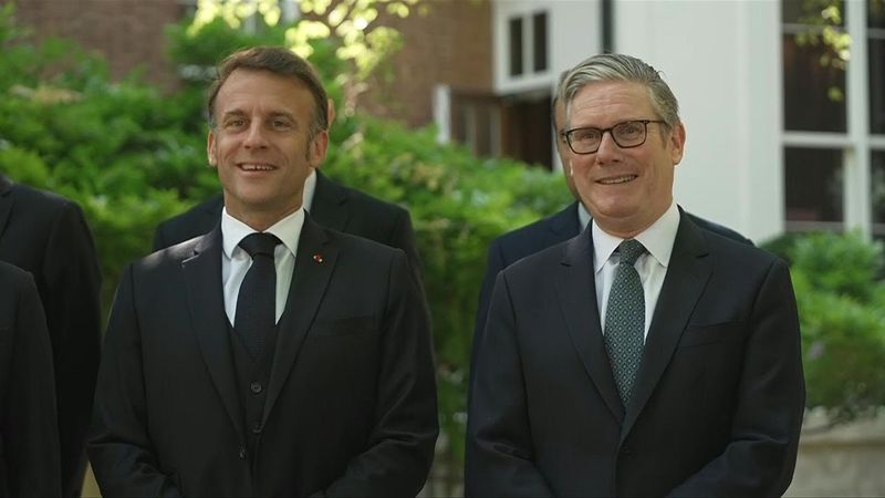 Macron and Starmer pose for photos at start of UK-France summit in London | AFP