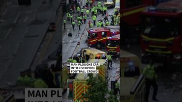Dozens injured after man ploughs car into Liverpool football crowd | AFP #shorts