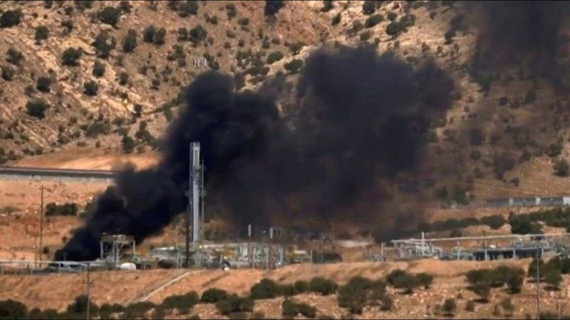 Smoke billows after drone attack at US-run oil field in Dohuk, northern Iraq, | AFP