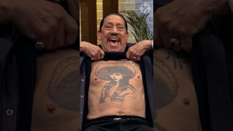Danny Trejo lifts his shirt during interview to show his chest tattoo! #dannytrejo #tattoo #gaming
