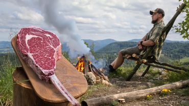 Stuffed Tomahawk Steak with Cheese Cooked in the Forest