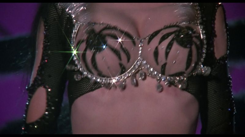 Elvira: Mistress of the Dark (1988) - iconic boobs scene
