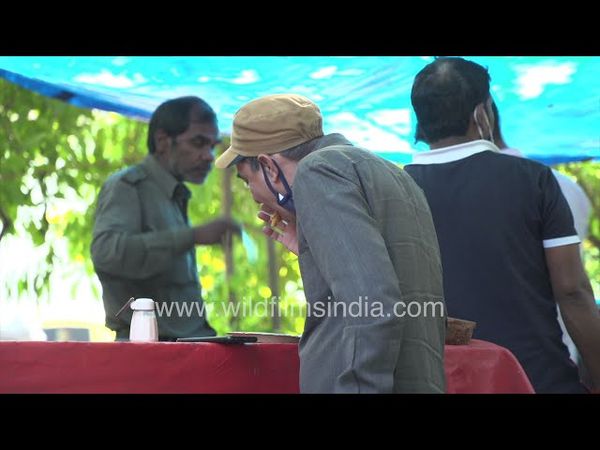 Auto drivers are eating lunch in a food corner near Sarojini NagarNew Delhi