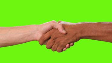 Copyright free green screen video | hands of two people shaking hands on a green background
