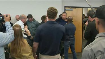 US senator forcibly removed from Trump official's press conference | AFP